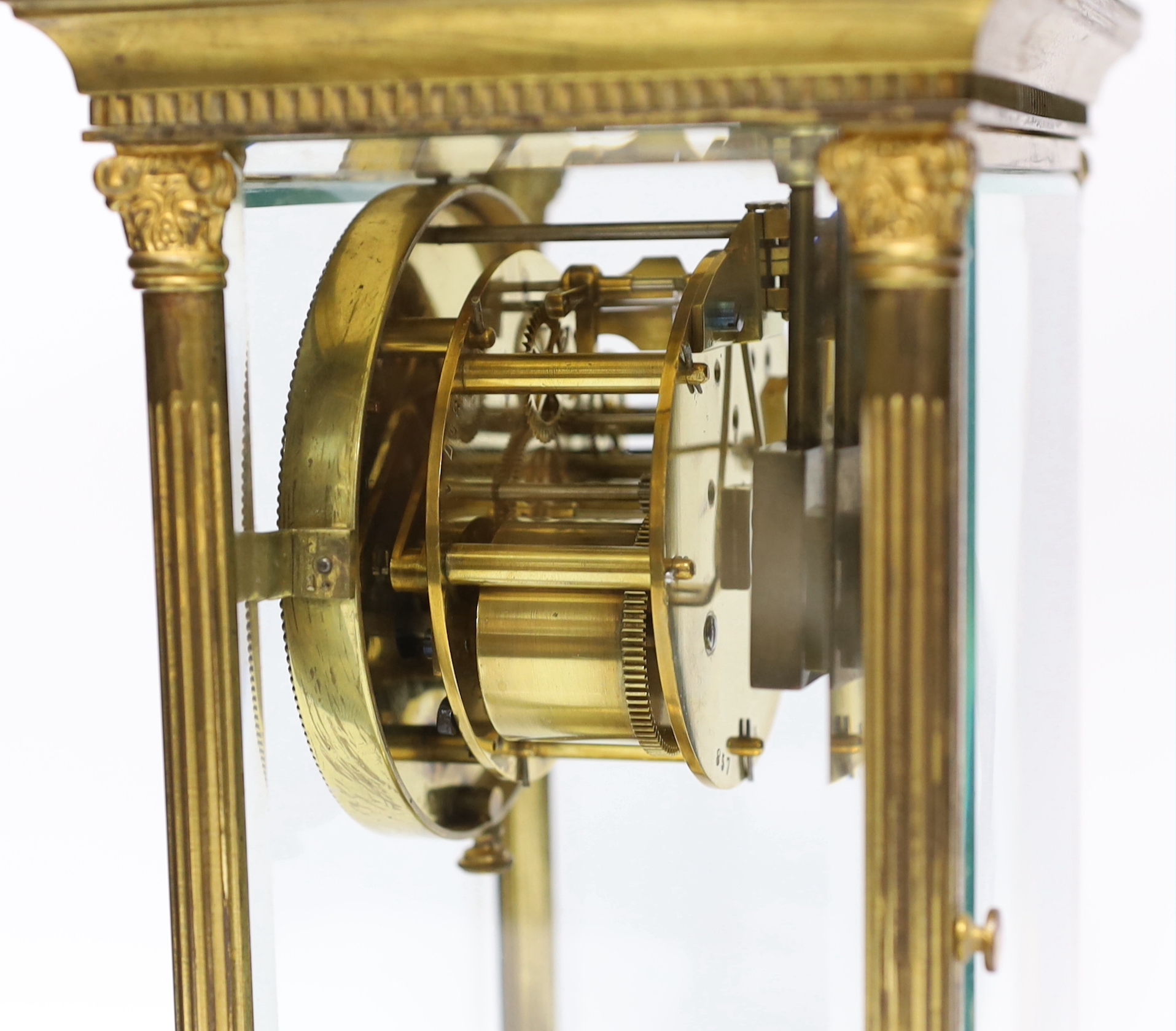 A 19th century French four glass clock, striking on a gong with mercury pendulum, 16.5cm wide x 28cm high